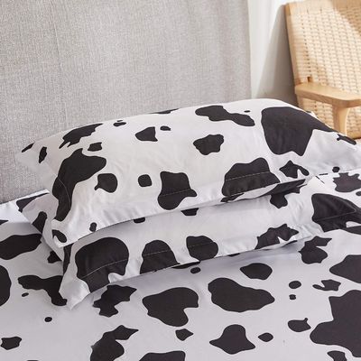 Set di lenzuola da mucca a grandezza naturale 4PCS 1800 Numero di fili Lenzuola da mucca bianca nera con tasche profonde
